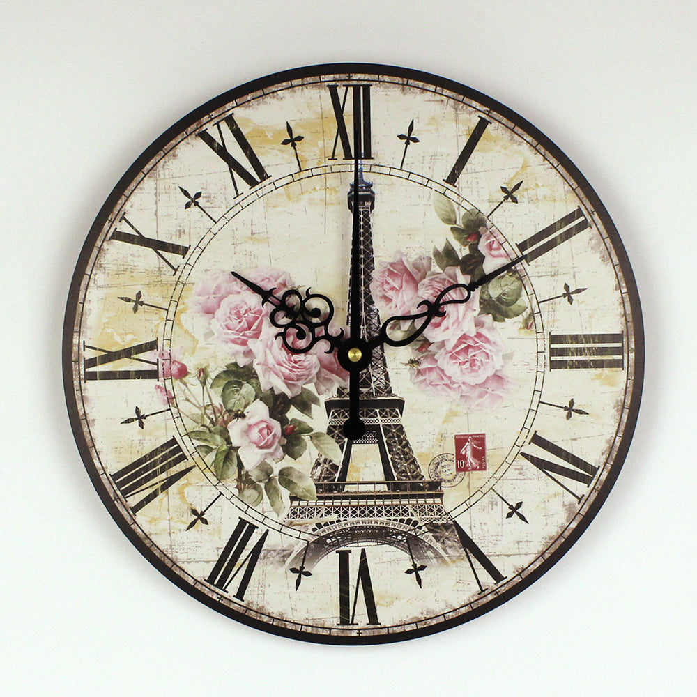 Decorative wall clock with Eiffel Tower and floral design on a white background