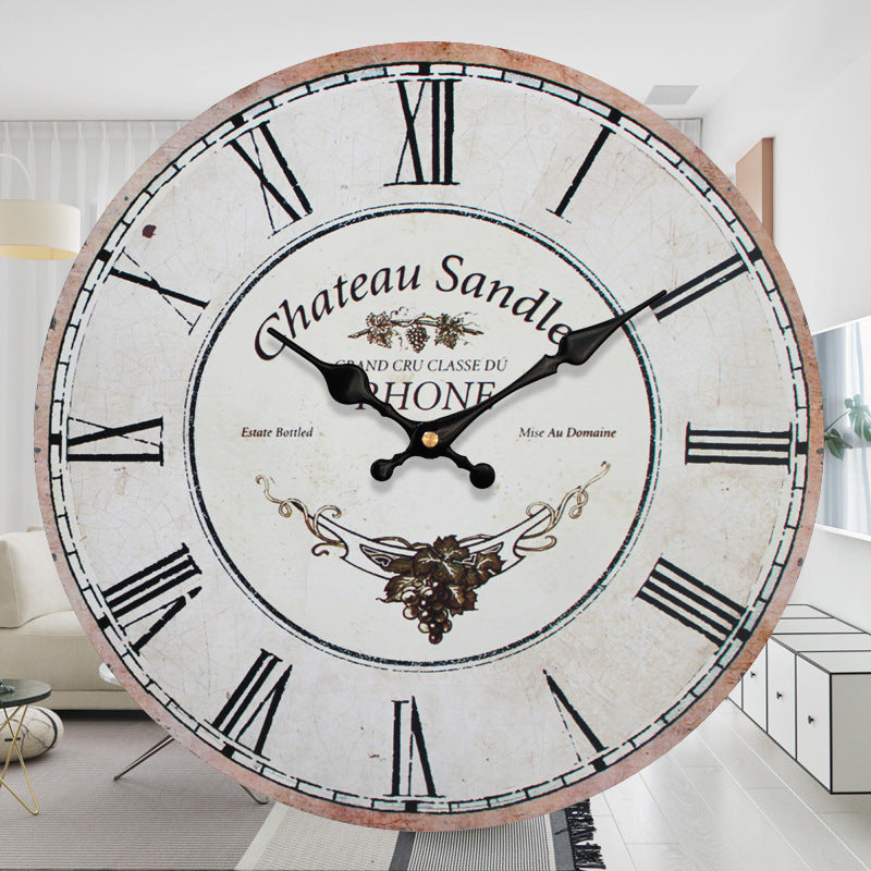 Large decorative clock with 'Chateau Sande' branding in a room setting