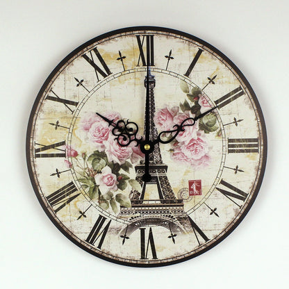 Decorative wall clock with Eiffel Tower and floral design on a white background