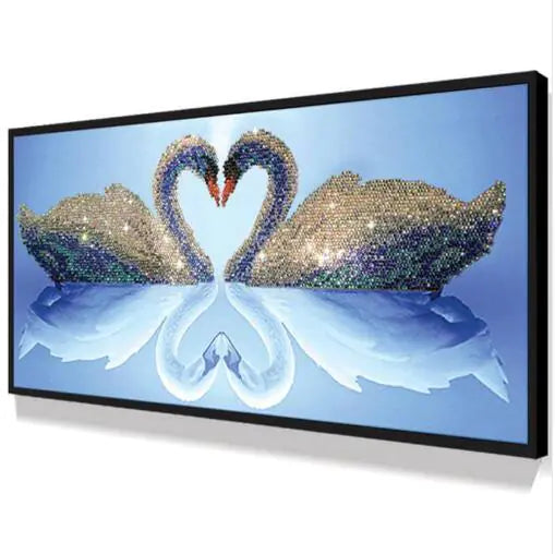 Decorative wall art of two swans made from rhinestones on a blue background.