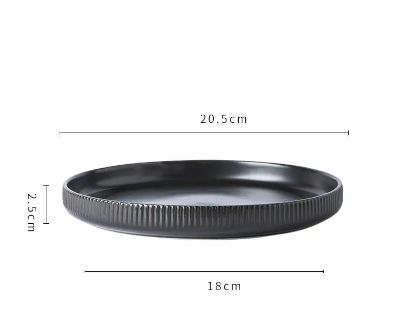 Black round tray with dimensions labeled on a white background