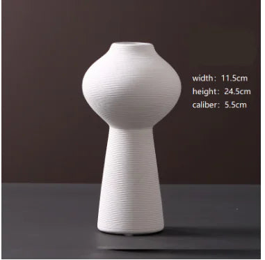 White textured vase on a dark surface with measurements displayed.