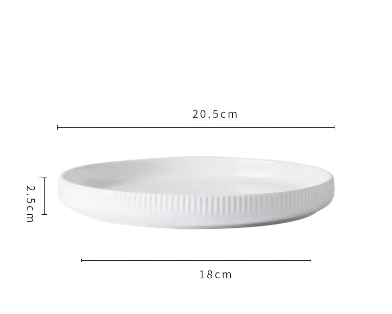 White ceramic plate with dimensions labeled on a white background
