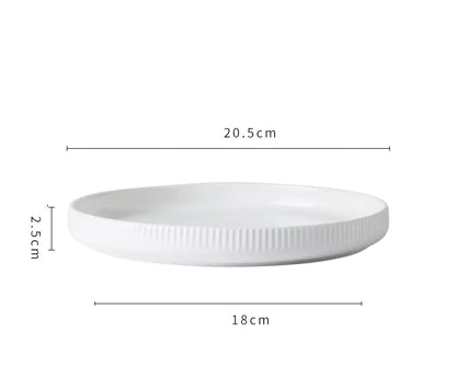 White ceramic plate with dimensions labeled on a white background
