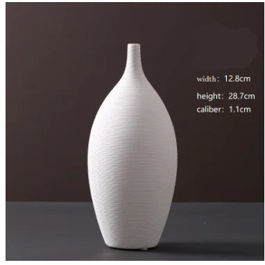 White ceramic vase on a dark background with measurements displayed.
