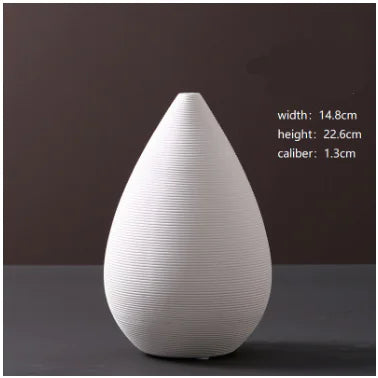 White ceramic vase with measurements on a dark background