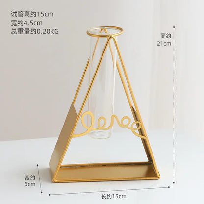 Gold geometric vase with measurements on a white background