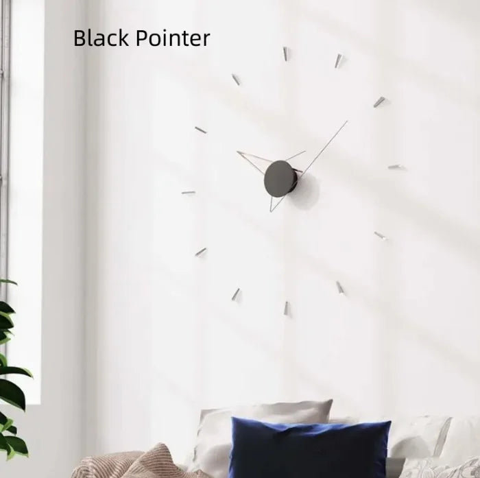 Wall clock with black pointer on a white wall