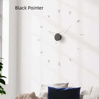Wall clock with black pointer on a white wall