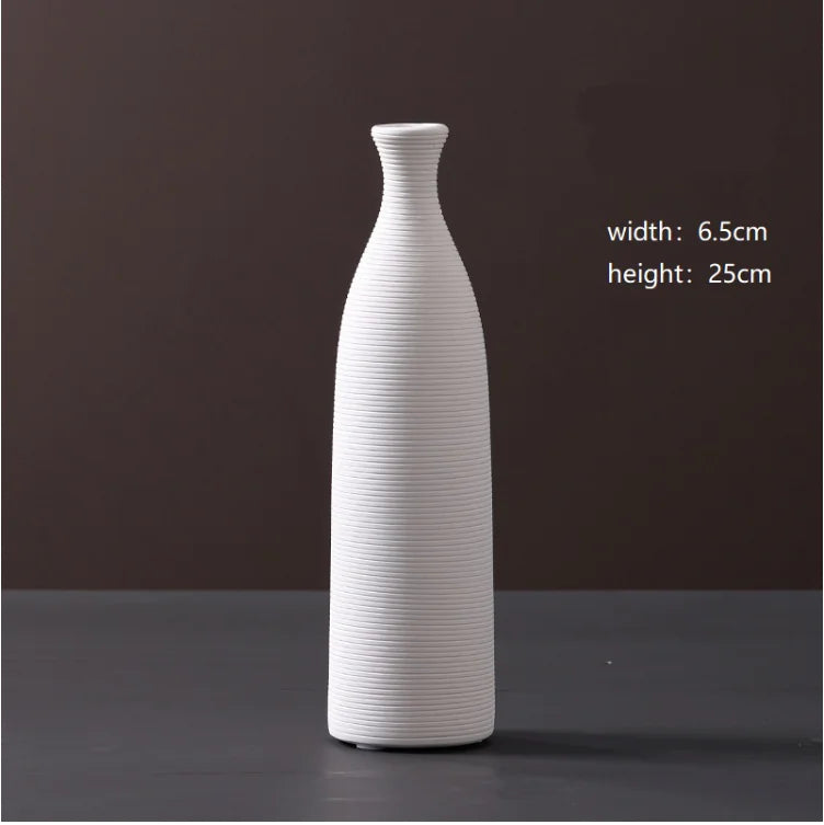 White ceramic vase on a dark background with measurements displayed.