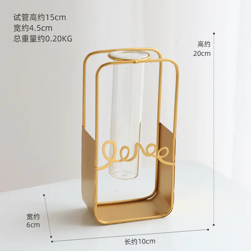 Gold-framed clear vase with measurements on a white background
